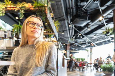 Portrait of young woman standing in gym