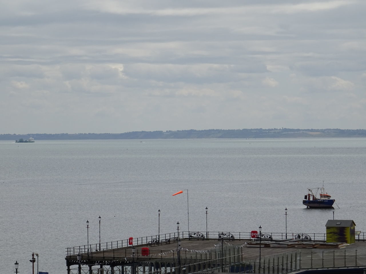 sea, cloud - sky, transportation, water, sky, mode of transport, day, nautical vessel, outdoors, built structure, nature, harbor, horizon over water, scenics, architecture, beauty in nature, no people, building exterior