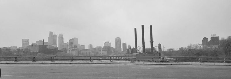 Modern buildings in city against clear sky