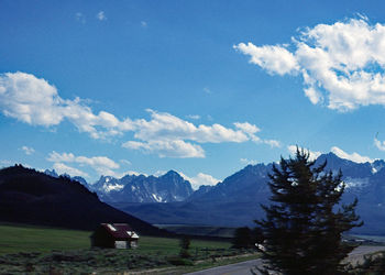 Scenic view of landscape and mountains against sky