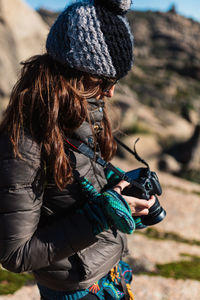 Midsection of woman photographing outdoors