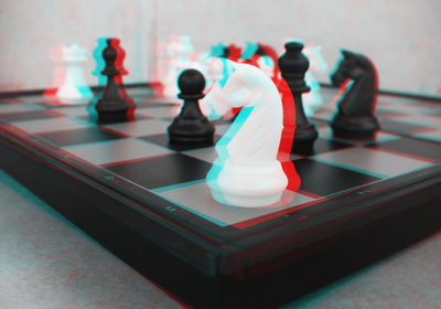 Close-up of chess pieces on table