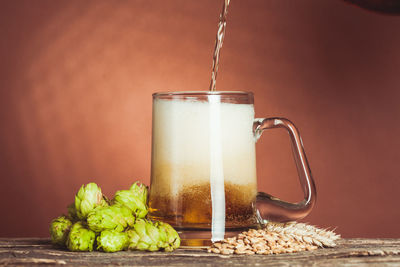 Close-up of drink in glass jar on table