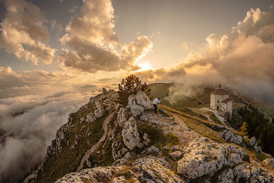 Panoramic view of rocks against sky during sunset