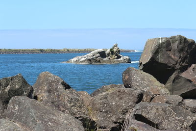 Scenic view of sea against blue sky