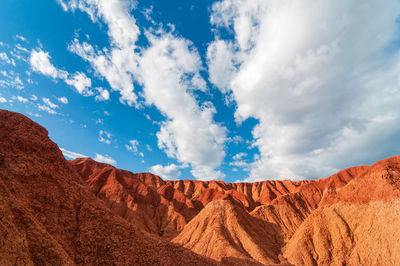 Scenic view of rock formations against cloudy sky at tatacoa desert