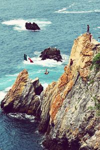 High angle view of cliff by sea