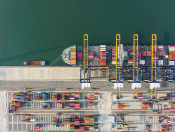 Aerial view of container ship moored at harbor