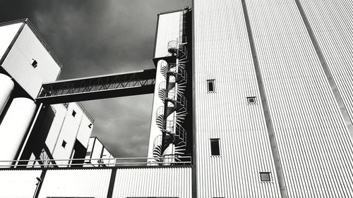 Low angle view of staircase by building against sky