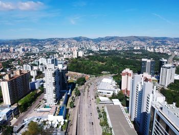 High angle view of street amidst buildings against sky