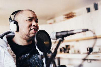 Disabled singer recording music in studio