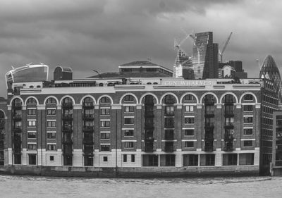 View of buildings against cloudy sky