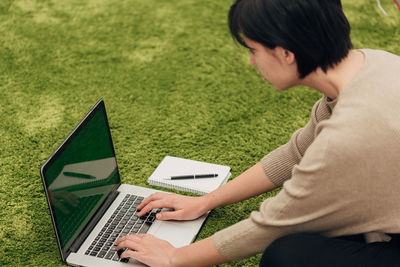 Young woman using laptop at home