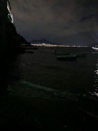 Scenic view of sea against sky at night