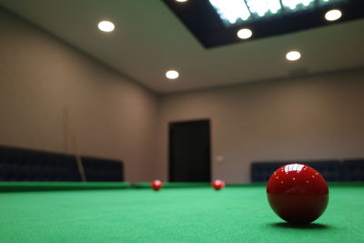 Ball of illuminated lights on table