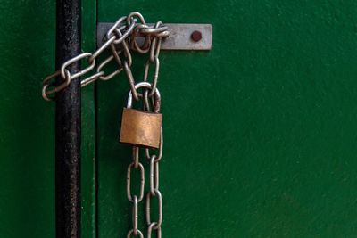 Close-up of padlock hanging on chain