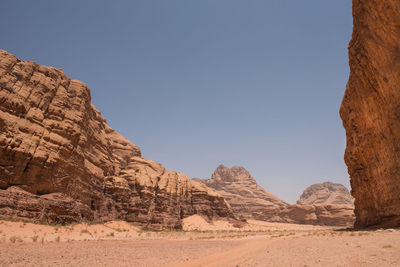 Rock formations at desert against sky