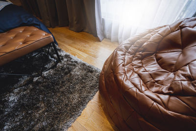 High angle view of bean bag and bed at home