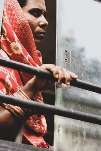 Woman looking through bus window