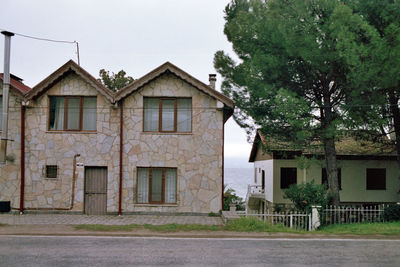 Building by road against sky