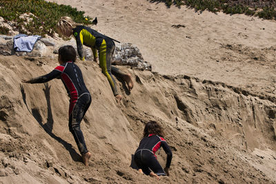 Rear view of people on rock