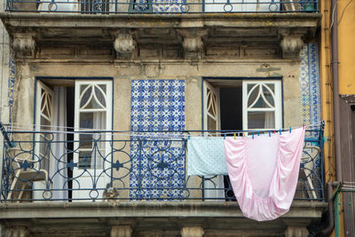 Low angle view of woman standing in front of building