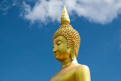 Low angle view of statue against sky