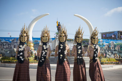 Rear view of women performing during festival
