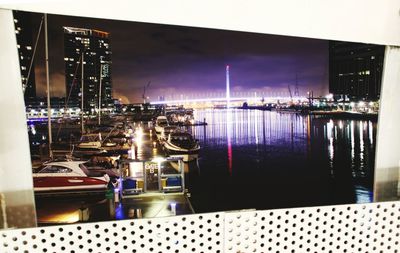 Reflection of illuminated buildings in water