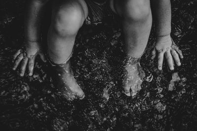 Low section of girl legs in water