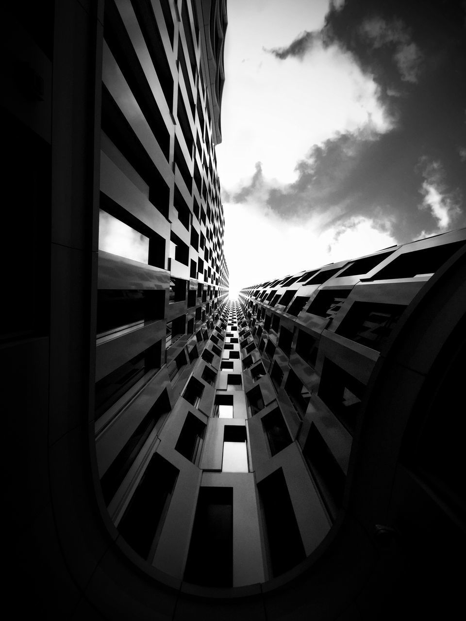 LOW ANGLE VIEW OF MODERN BUILDINGS AGAINST SKY