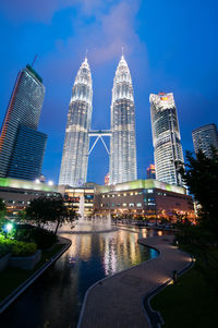 Low angle view of illuminated skyscrapers