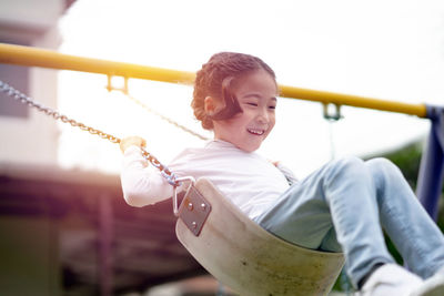 Portrait of smiling girl playing outdoors
