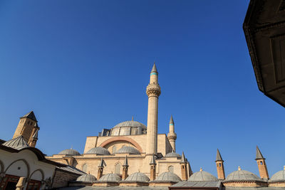 Low angle view of mosque against blue sky