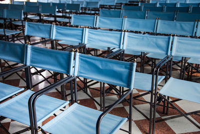 High angle view of empty chairs on floor