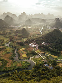 Aerial view of landscape and mountains against sky