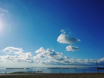 Scenic view of sea against blue sky