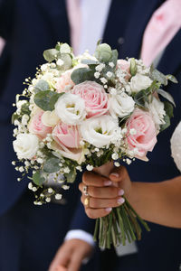 Bridal bouquet with roses, lisianthus and eucalyptus