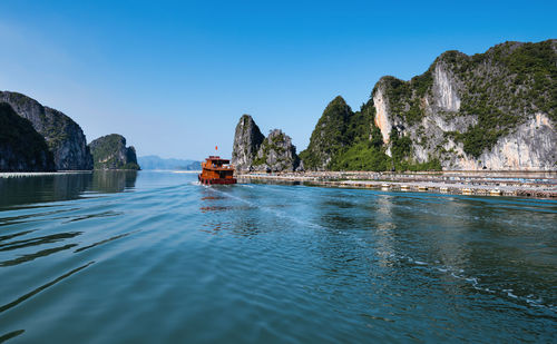 Scenic view of sea against clear blue sky