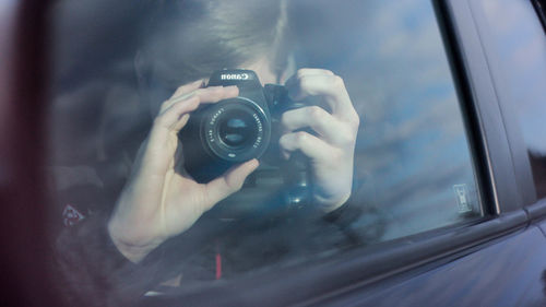 Woman photographing through camera