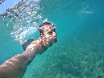 Man swimming in sea