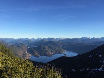 Scenic view of mountains against blue sky