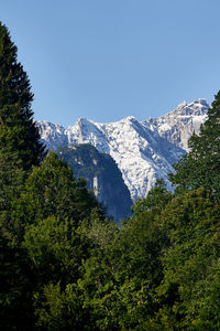 Scenic view of snowcapped mountains against clear sky