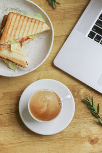 High angle view of coffee cup on table