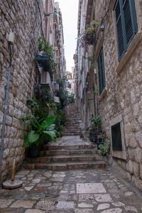 Narrow alley amidst buildings in town