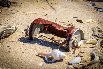 Close-up of abandoned objects on beach