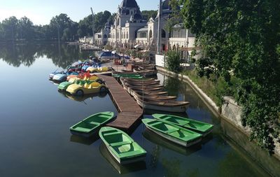 Boats in river with buildings in background