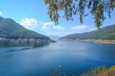 Scenic view of lake against blue sky