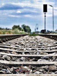 Close-up of railroad track against sky