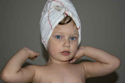 Portrait of cute wearing towel girl at home 